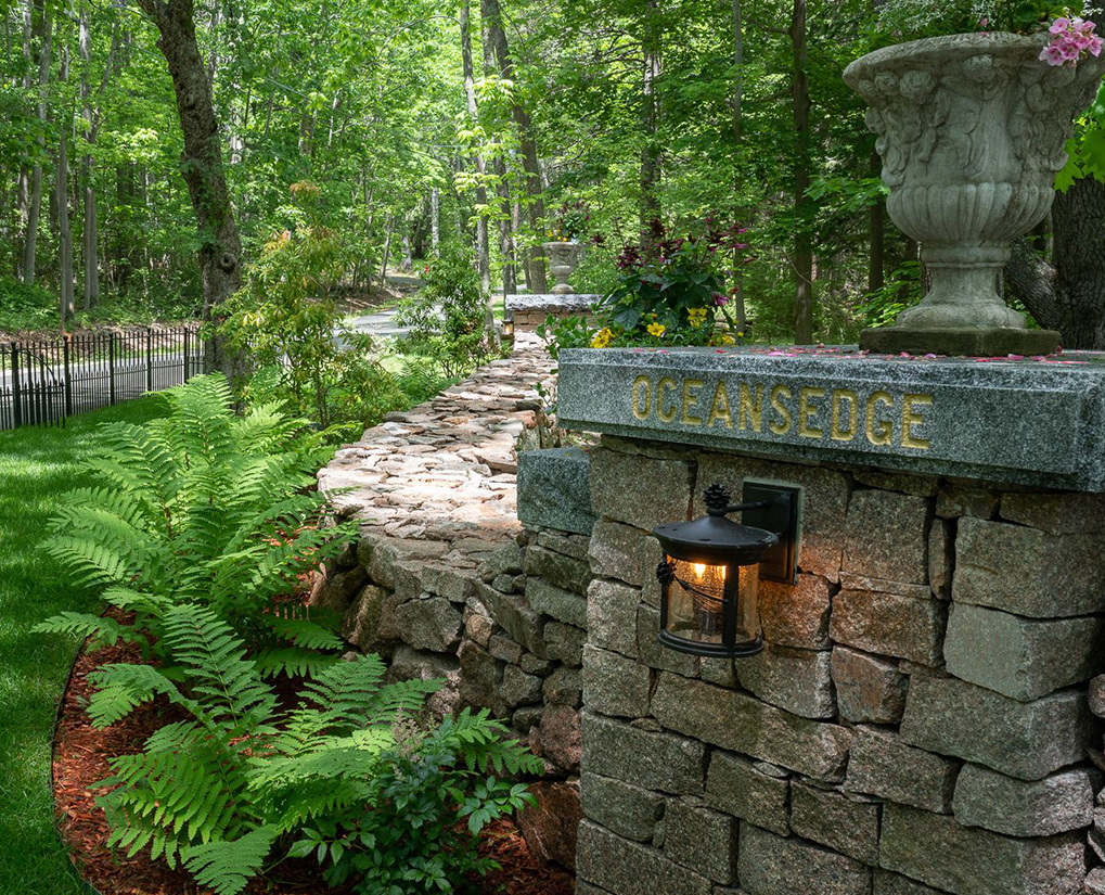 View of a pillar that reads 'Oceansedge' at the entrance to the property